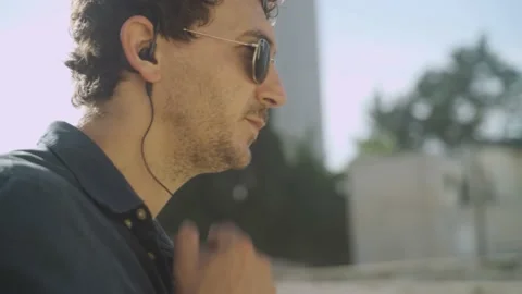 Special agent or spy during a watch looking down a roof - talks to a radio Stock-Footage 131279286