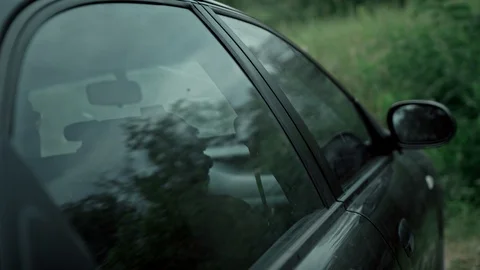 Special agent performs a secret mission. Fighting Shooting from the car. Stock Footage 107531829