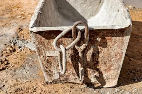 A special container in the form of a trough for supplying mortar or concrete  Photos