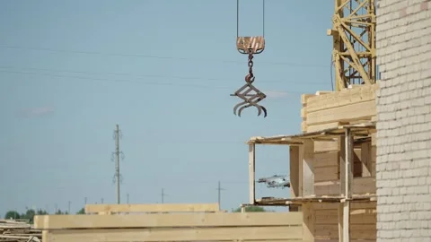 Special crane for lifting logs during house construction Stock Footage 321181672
