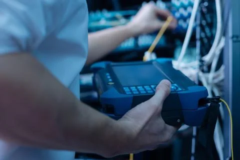 Special device being in hands of a data center engineer Stock Photos