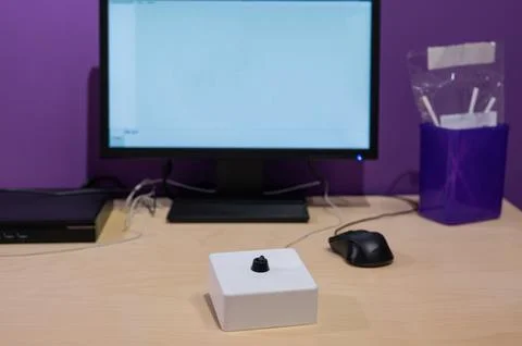 A special device for the paralyzed helps to control the computer mouse with a Stock Photos