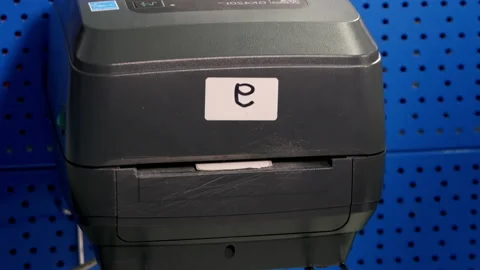 Special device prints receipt with barcode in warehouse Stock Footage 238468163