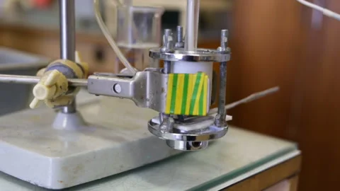 Special DIY Electrolytic cell stands on the table. Side view, real time, indoors Stock Footage 85615879