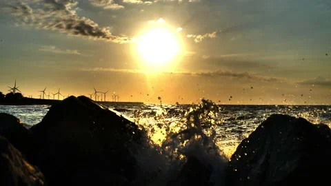 The special effect of shooting the sunrise overlooking the wind farms Stock Footage 164921453