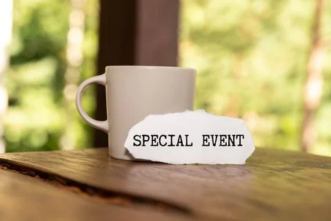 Special event. notepad on the work table near the black magnifying glass. Stock Photos