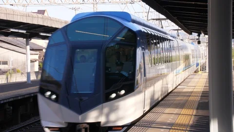 Special Express Train Rides Through Mukaijima Station - Kyoto Japan Stock Footage 94724514