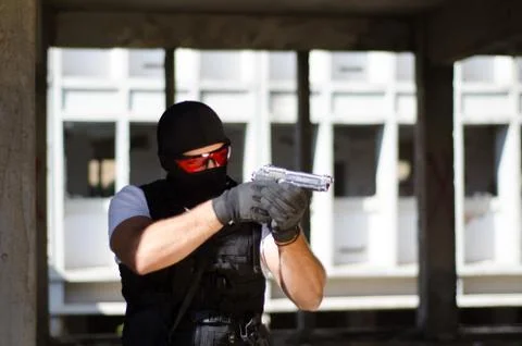 Special force men aim target with hand gun Stock Photos