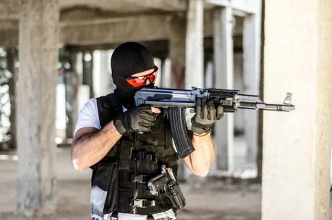 Special force men aim target with rifle Stock Photos