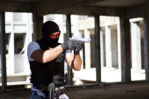 Special force men aim target with hand gun Stock Photos