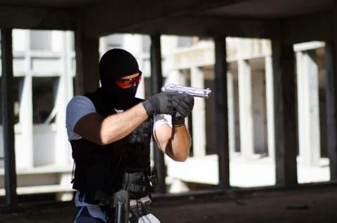 Special force men aim target with hand gun Stock Photos