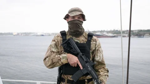 Special force unit on the board of vessel, holding M16 rifle. Video stock 117187448