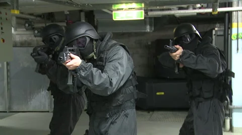 Special Forces carfully stepping forward Stock Footage