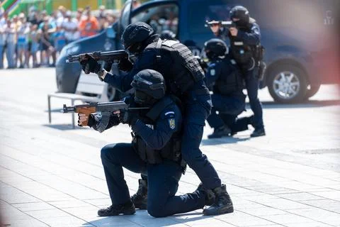 Special forces conduct training exercise in urban setting with crowd observ.. Stock Photos