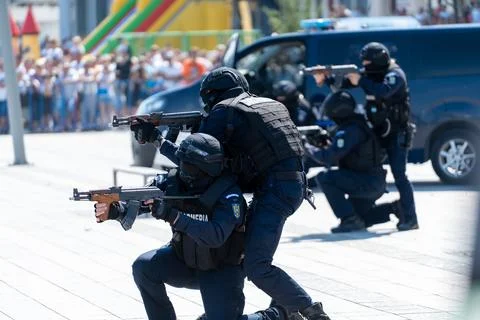 Special forces conduct training exercise in urban setting with a crowd in t.. Stock Photos