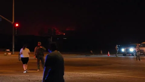 Special forces control traffic in Hemet, during wildfires of California Stock Footage 218414095