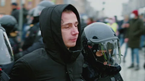 Special forces detained man at demonstration. Police detaining protestor Stock Footage 147351024