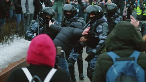 Special forces detained man at demonstration. Police detaining protestor. Arrest Stock Footage 147351839