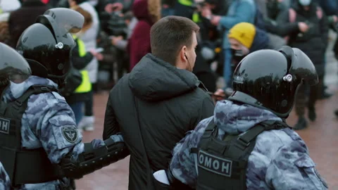 Special forces detained man at demonstration. Police detaining protestor. Arrest Stock Footage 147410508