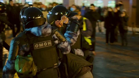 Special forces detained man at demonstration. Police detaining protestor. Arrest Stock Footage 147410707