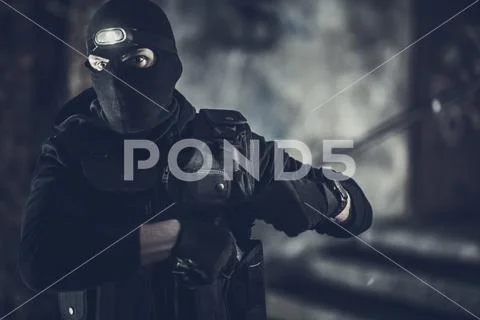 Special Forces Operation. Caucasian Policeman Wearing Black Mask and Uniform. Stock Photos