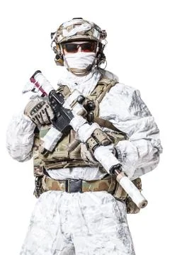 Special forces operator in winter camo clothes Stock Photos