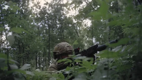 Special forces soldier in dense deciduous forest, on alert for special operation Stock Footage 327350898