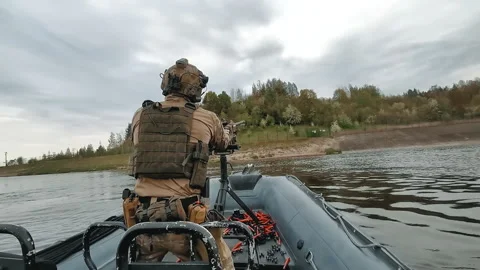 Special Forces Soldier Shot With Machine Gun. Patrol Boat, River. War In Ukraine Stock Footage 194531114