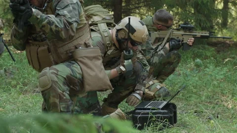 Special Forces Soldiers Using Laptop In Jungle Stock Footage 147721979