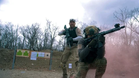 Special Forces soldiers work out exercises with small arms Stock Footage 128125358