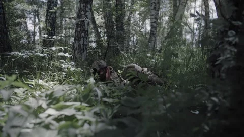 Special Forces soldiers work as team protecting the front line Stock Footage 327351430