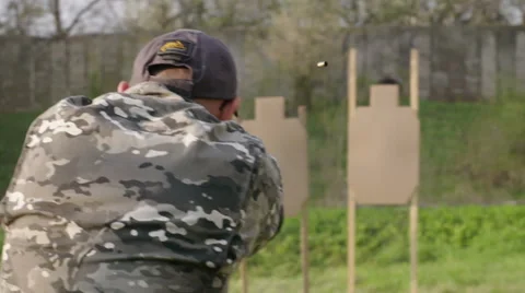 Special forces solider exercise shooting a gun while running at military camp Stock Footage 64373010