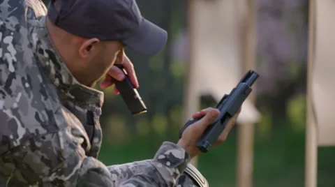 Special forces solider reloading his gun Stock Footage 64363034