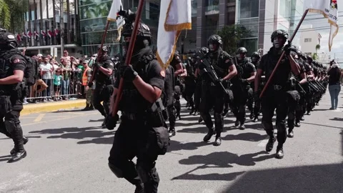 Special forces unit in black uniforms marching in San Francisco de Macoris Video stock 328601516