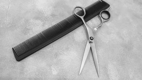 Special hairdressing scissors and comb. Professional equipment. Фото