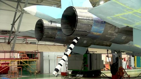Special hook with which the plane clings to brake cables. Maintenance of Su-33. Stock Footage 134546549