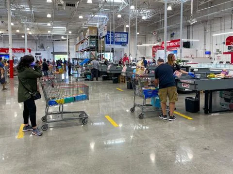 Special lines social distancing for shoppers at Costco during COVID-19 pandemic. Stock Photos