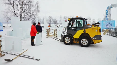 Special loader helping to move ice cube Stock Footage 37884548
