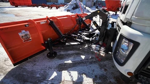 A special machine with a blade for clearing snow Stock Footage 106015210