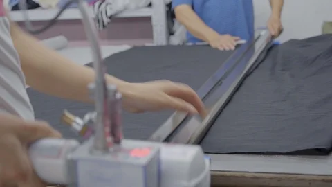 A special machine for cutting layer of cloth before sewing Stock Footage 89716232