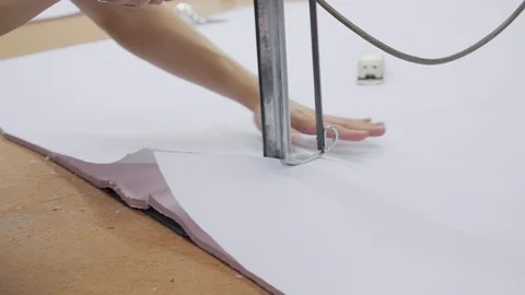 A special machine for cutting many layers of cloth before sewing Stock Footage 89714878