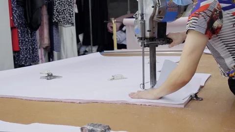 A special machine for cutting many layers of cloth before sewing Stock Footage 89715208