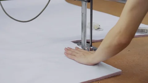 A special machine for cutting many layers of cloth before sewing Stock Footage 89715912