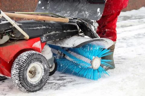 Special machine for snow removal cleans the road Stock Photos