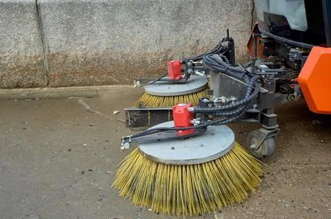 A special machine sweeps city paths Stock Photos