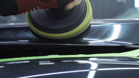 With special machine worker cleans hood of car, hood and whole body are shining Stock Footage 115933540