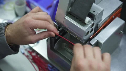 A special machine wraps insulating tape around the cable bundle Stock Footage 321897175