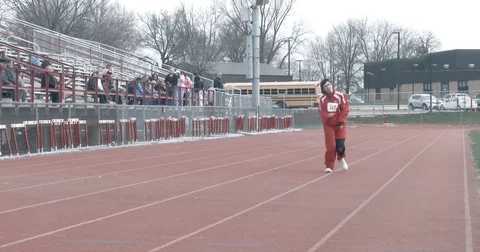 Special Olympics Runner Crosses Finish Line of Race Stock Footage 77735705