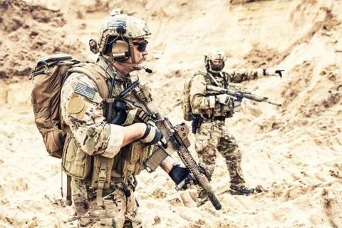 Special operations forces team raiding in desert Stock Photos