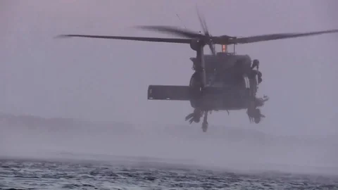 Special Operations members jump from UH-60 during a helocast training - 2015 Stock Footage 99728128